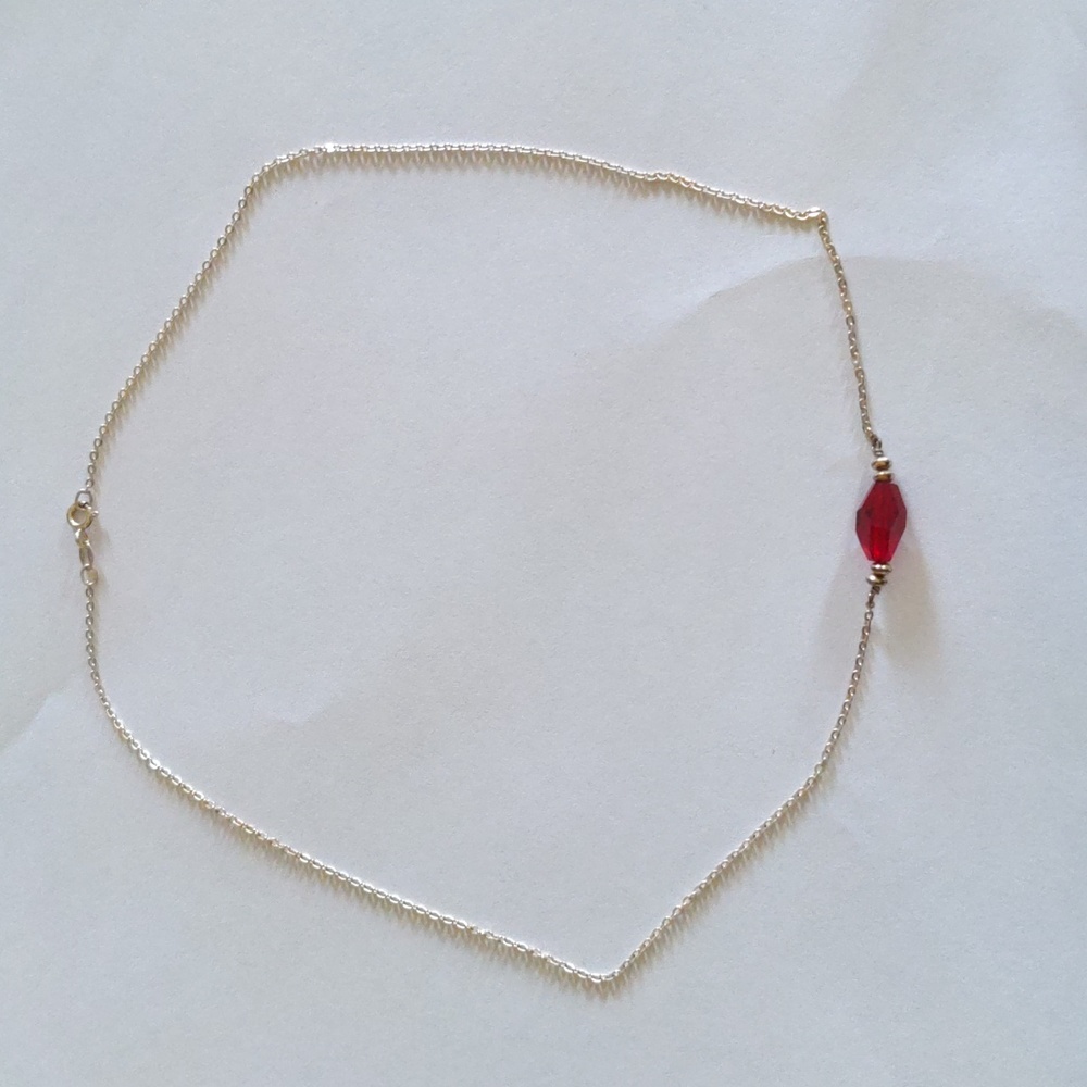 Necklace with a  Rudy in the middle of the necklace.